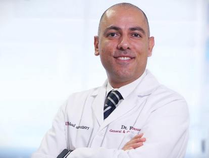 smiling Dr. Bernard Baseri